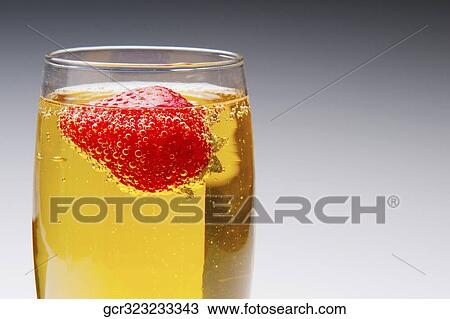 Close-up of a strawberry in a champagne flute View Large Photo Image Stock Image - Close-up of a strawberry in a champagne flute. Fotosearch