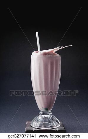Stock Image - Close-up of a strawberry milkshake. Fotosearch
