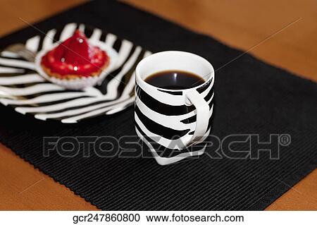 Close-up of a strawberry tart and a cup of coffee View Large Photo Image Stock Image - Close-up of a strawberry tart and a cup of coffee. Fotosearch