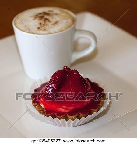 Close-up of a strawberry tart and a cup of coffee View Large Photo Image Stock Photo - Close-up of a strawberry tart and a cup of coffee. Fotosearch
