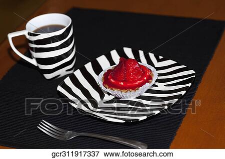 Close-up of a strawberry tart and a cup of coffee View Large Photo Image Stock Photo - Close-up of a strawberry tart and a cup of coffee. Fotosearch