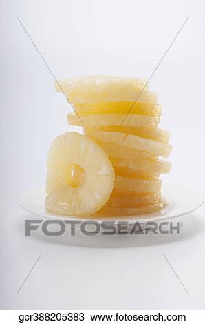 Close-up of a tower of pineapple slices View Large Photo Image Stock Image - Close-up of a tower of pineapple slices. Fotosearch