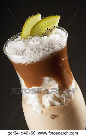 Close-up of a tropical chocolate dessert topped with kiwi slices View Large Photo Image Stock Image - Close-up of a tropical chocolate dessert topped with kiwi slices. Fotosearch