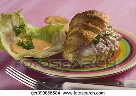Picture - Close-up of a tuna stuffed croissant. Fotosearch