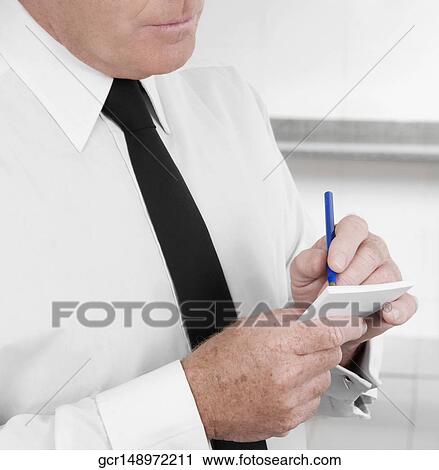 Close-up of a waiter taking orders View Large Photo Image Stock Image - Close-up of a waiter taking orders. Fotosearch