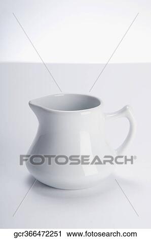 Close-up of a white ceramic jug View Large Photo Image Stock Image - Close-up of a white ceramic jug. Fotosearch