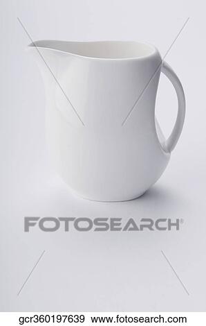 Close-up of a white ceramic jug View Large Photo Image Stock Photo - Close-up of a white ceramic jug. Fotosearch