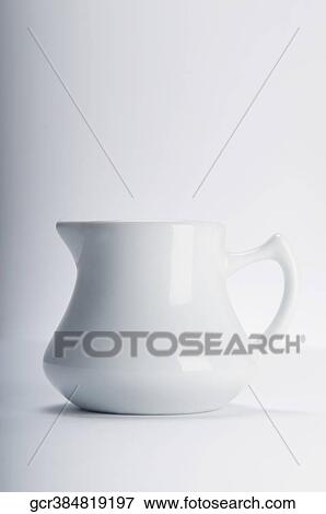 Close-up of a white ceramic jug View Large Photo Image Stock Photo - Close-up of a white ceramic jug. Fotosearch