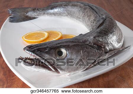 Close-up of a whole raw fish with orange slices View Large Photo Image Stock Photography - Close-up of a whole raw fish with orange slices. Fotosearch