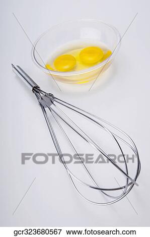 Close-up of a wire whisk and egg yolk in a bowl View Large Photo Image Stock Photo - Close-up of a wire whisk and egg yolk in a bowl. Fotosearch