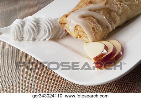 Stock Image - Close-up of an apple Danish pastry. Fotosearch
