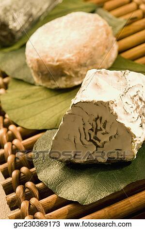 Close-up of assorted cheese on a bamboo platter View Large Photo Image Stock Image - Close-up of assorted cheese on a bamboo platter. Fotosearch