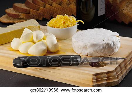 Close-up of assorted cheeses served with bread View Large Photo Image Stock Photograph - Close-up of assorted cheeses served with bread. Fotosearch
