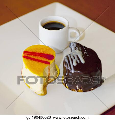 Close-up of assorted pastries with a cup of black coffee View Large Photo Image Stock Photograph - Close-up of assorted pastries with a cup of black coffee. Fotosearch