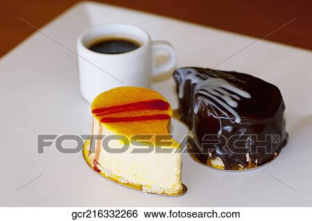 Close-up of assorted pastries with a cup of black coffee View Large Photo Image Stock Photograph - Close-up of assorted pastries with a cup of black coffee. Fotosearch