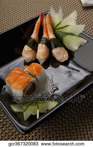 Close-up of assorted sushi on a platter View Large Photo Image Stock Image - Close-up of assorted sushi on a platter. Fotosearch