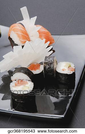 Stock Image - Close-up of assorted sushi on a platter. Fotosearch