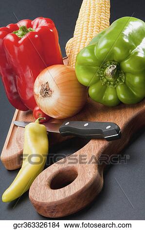 Close-up of assorted vegetables on a cutting board View Large Photo Image Picture - Close-up of assorted vegetables on a cutting board. Fotosearch
