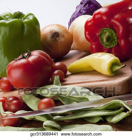 Close-up of assorted vegetables on a cutting board View Large Photo Image Stock Image - Close-up of assorted vegetables on a cutting board. Fotosearch