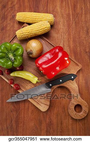 Close-up of assorted vegetables on a cutting board View Large Photo Image Stock Image - Close-up of assorted vegetables on a cutting board. Fotosearch