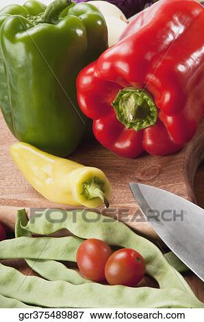 Close-up of assorted vegetables on a cutting board View Large Photo Image Stock Photo - Close-up of assorted vegetables on a cutting board. Fotosearch