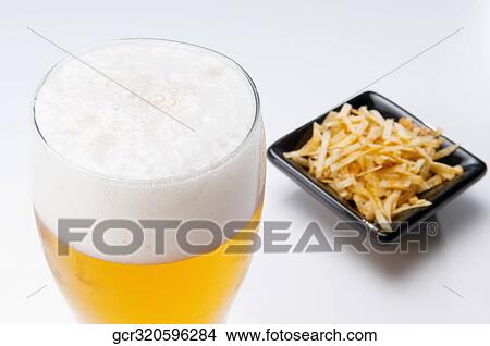 Close-up of beer and chips View Large Photo Image Picture - Close-up of beer and chips. Fotosearch