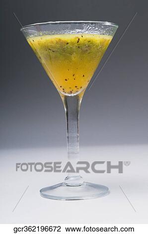 Close-up of blended orange and kiwi cocktail View Large Photo Image Stock Image - Close-up of blended orange and kiwi cocktail. Fotosearch