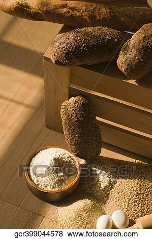 Close-up of bowl of flour with breads and eggs View Large Photo Image Stock Photo - Close-up of bowl of flour with breads and eggs. Fotosearch