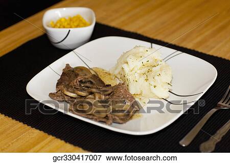 Stock Photo - Close-up of braised lamb with mashed potatoes. Fotosearch