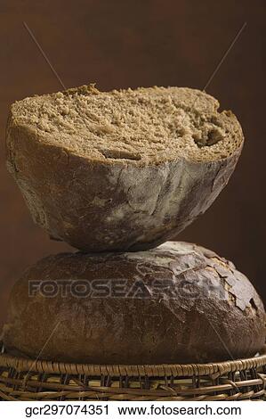 Stock Image - Close-up of breads in a wicker basket. Fotosearch