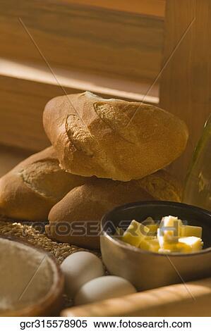 Close-up of breads with a bowl of butter and eggs View Large Photo Image Stock Photography - Close-up of breads with a bowl of butter and eggs. Fotosearch