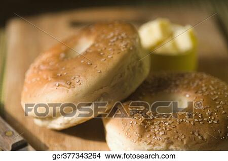 Close-up of breads with a knife on a cutting board View Large Photo Image Picture - Close-up of breads with a knife on a cutting board. Fotosearch