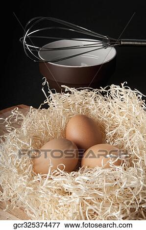 Close-up of brown eggs in a nest View Large Photo Image Stock Photo - Close-up of brown eggs in a nest. Fotosearch