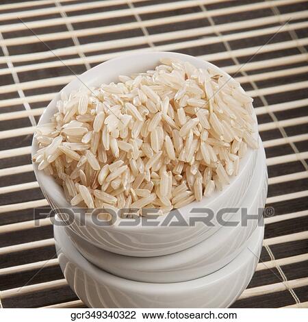Close-up of brown rice in a tower of ceramic bowls View Large Photo Image Stock Image - Close-up of brown rice in a tower of ceramic bowls. Fotosearch