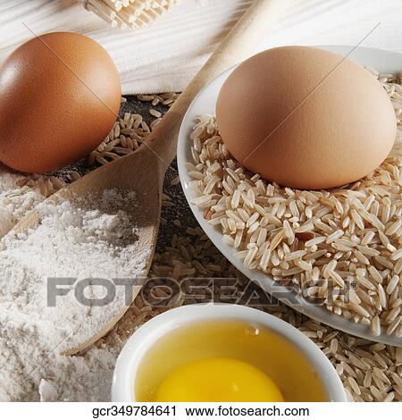 Close-up of brown rice with flour and eggs View Large Photo Image Stock Image - Close-up of brown rice with flour and eggs. Fotosearch