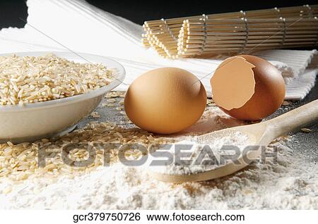 Close-up of brown rice with flour and eggs View Large Photo Image Stock Photograph - Close-up of brown rice with flour and eggs. Fotosearch