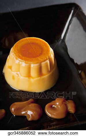 Close-up of caramel custard in a bowl View Large Photo Image Stock Image - Close-up of caramel custard in a bowl. Fotosearch