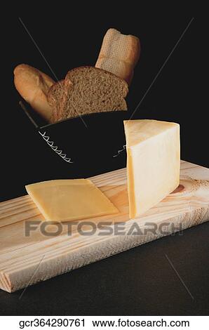 Close-up of cheese and breads View Large Photo Image Stock Image - Close-up of cheese and breads. Fotosearch