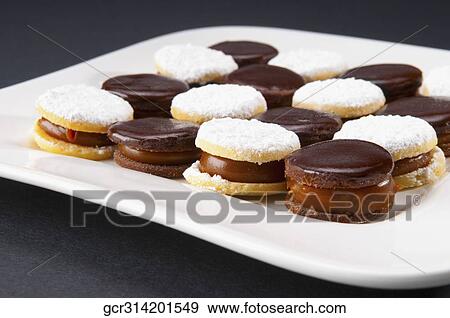 Close-up of chocolate cream cookies on a tray View Large Photo Image Stock Photo - Close-up of chocolate cream cookies on a tray. Fotosearch