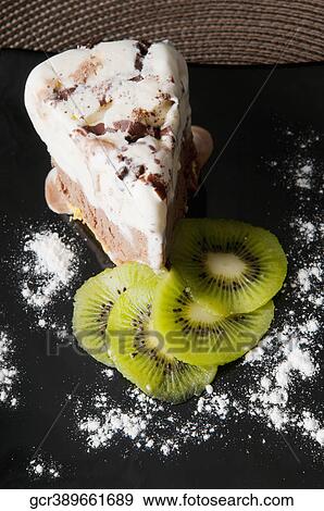 Close-up of chocolate mousse cake with slices of kiwi fruit View Large Photo Image Stock Photo - Close-up of chocolate mousse cake with slices of kiwi fruit. Fotosearch