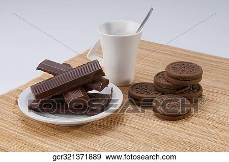 Close-up of chocolate with cookies and a cup of coffee View Large Photo Image Stock Photo - Close-up of chocolate with cookies and a cup of coffee. Fotosearch