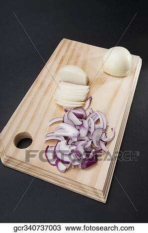 Close-up of chopped onions on a cutting board View Large Photo Image Stock Image - Close-up of chopped onions on a cutting board. Fotosearch