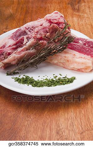 Close-up of chops marinated with herbs View Large Photo Image Stock Photography - Close-up of chops marinated with herbs. Fotosearch