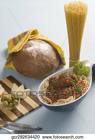 Stock Image - Close-up of cooked pasta with ingredients. Fotosearch