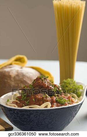 Stock Image - Close-up of cooked pasta with ingredients. Fotosearch