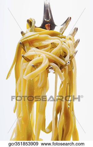 Close-up of cooked spaghetti on a ladle View Large Photo Image Stock Photo - Close-up of cooked spaghetti on a ladle. Fotosearch