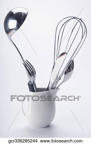 Close-up of cooking tools in a ceramic jug View Large Photo Image Picture - Close-up of cooking tools in a ceramic jug. Fotosearch