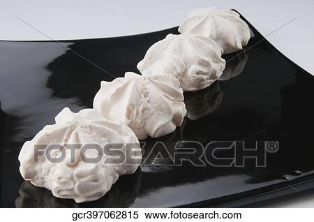 Close-up of cream meringues on a platter View Large Photo Image Stock Photography - Close-up of cream meringues on a platter. Fotosearch