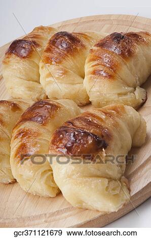 Stock Photo - Close-up of croissants on a cutting board. Fotosearch