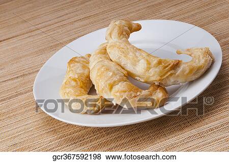 Stock Photo - Close-up of croissants on a platter. Fotosearch
